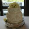 2 tier Grecian style wedding cake. 
This two tier cake was made with our Carrot Cake and Cream Cheese Buttercream filling.