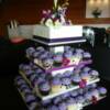 Purple Cupcakes and cutting cake.
A 10" square cutting cake sits on top of our cake tower that is holding 100 cupcakes for this spring wedding. 