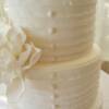 A closer look at the ruffle work that we did as well as the fondant buttons going up the front of the cake. 