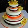 3 tiered round Carrot Cake with a Cream Cheese Buttercream filling and yellow orchids. 