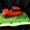 3-D Sculpted Jeep Grand Cherokee made for Chysler Canada to celebrate one of their local car dealerships milestones. The jeep was sculpted from our Red Velvet Cake, while the bottom was our Chocolate Chiffon cake filled with Chocolate Ganache, and Vanilla Chifon Cake filled with Amaretto Mocha 