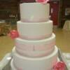 4 tier round Pink and Rhinestone Wedding Cake with Pink handmade sugar roses. 