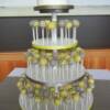 Grey and Yellow Cake Pops with a cutting cake for a Harvest Golf Club wedding. The cake pops were decorated with different designs, and displayed on our new white Cake Pop Stand. 