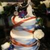 2 tiered Blue and Copper Criss-Crossed cake.
We added the blue and copper ribbon onto the cake to copy the way the ties went around the brides waist of her wedding dress. 