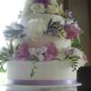 Close-up of the the fresh flower lilac ribbon cake.