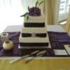 3 tiered square purple and gold wedding cake with a purple sugar peony.