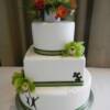 3 tier Chocolate Brown and Green Wedding Cake. We loved making this cake as it was personalized from the beginning! Every design detail you see on this cake had to do with something in their wedding from the penny sitting on top, the puzzle piece or the sillhoette on the bottom tier!