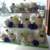 40 lace cupcakes with green, white and purple sugar flowers that were delivered to Summerhill Winery. 