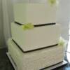 3 tier sqaure wedding cake with Fondant Ruffles on the bottom tier, Damask Stencil on the middle tier and SugarVeil Swiss Dots on the top tier