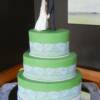 3 tier Oval Wedding Cake with a twist- A zombie battle on the back 
