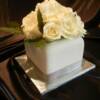 6 inch Square Cream Rose cake. This cake was made for a 2 person wedding held over at The Cove in Westbank. 
Inside, the cake was our Carrot Cake with pecans, filled and covered with Cream Cheese Buttercream