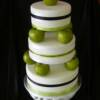 Green Apple Wedding cake
3 tiered, round wedding cake covered in white fondant and multi-colored ribbon.