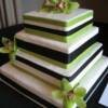 4 tiered square cake with green orchids. 
