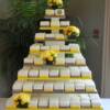 Yellow and Grey Miniature Wedding Cakes. The 150 mini wedding cakes were a mixture of Vanilla Bean cake with Lemon/ Lime Curd filling, Bavarian Cream filling or Blackberry Buttercream filling. 