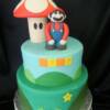 Mario Brothers themed Groom' s Cake.
This two tiered cake was made as a surprise for the groom during their rehearsal dinner before the big day. This cake is made from our Marble Chiffon Cakes and filled with Amaretto Mocha Buttercream.