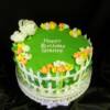 10"round Garden Themed birthday cake with fondant flowers, fence and grass. 