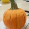 Close up of the completed hand-sculpted Fondant Pumpkin before it was added to the Henna Birthday Cake. 