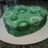 Heart shaped shower cake with hand cut fondant circles.