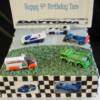 10 inch square Daytona Racing birthday cake.
This cake was a Dark Chocolate Cake with Whipped Chocolate Ganache filling. 