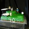40th Birthday Golf Themed cake.
This cake was made with our Vanilla Chiffon Cake and filled with our Fresh Sour Cherries and Whipped Chocolate Ganache (Chocolate Dipped Cherry). We then covered both tiers with green fondant and added all of our hand-made characters.