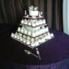 Silver and Purple Miniature weddng cakes with a round cutting cake. 