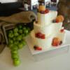 Paisley Shaped Buttercream covered wedding cake with fresh fruit placed on the cake. 