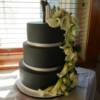 3 tier Black Wedding Cake with White Cala Lilies Cascading down the front.