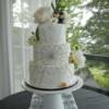 3 tier round Edible Diamond Starburst wedding cake. This cake was made with over 1200 edible sugar diamonds to replicate the brides wedding dress.  