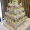 Pale Pink, Round Miniature wedding cakes with a cutting cake were displayed on our Miniature Cake tower. Each cake had freesias and white orchids added on top upon set-up at Manteo Resort. 