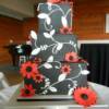 The newest trend for 2013 after Vira Wang premiered black wedding dresses this season, the Black wedding cake will be seen more and more the coming years! This striking black and red wedding cake is beautiful in its simplicity, especially with the white accents piped onto this cake. 