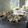 Wedding Cupcakes! 3 different flavors of filled cupcakes were displayed in this outdoor wedding, along with a Pale Pink Buttercream covered cutting cake.