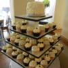 Black and White Cupcakes with  buttercream rosettes piped icing. 2 different flavors of filled cupcakes were piped with buttercream and candy pearls.