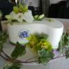 Paisley Shaped single tier wedding cake with fresh flowers