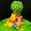 Close-up of the fondant Winnie the Pooh and Piglet figurines made for this birthday cake.