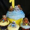 Close-up of the birthday cupcakes with the fondant Monkeys, Kittens and Puppies sitting in front of the Smash Cake made for this boys 1st birthday!