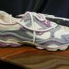 Close-up view of one of the running shoes made out of cake. 