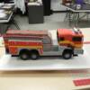 3-D Sculpted Firetruck made for a 60th Birthday Celebration. This cake drives with a remote control, and even had working lights and siren!!!!