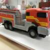Close-up view of the 3-D sculpted remote control firetruck birthday cake. For more photos of this cake, check out our Whisk Cake Company Facebook Page!
